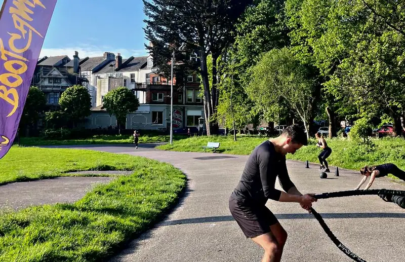 A bootcamper on the battle ropes at Victoria Park