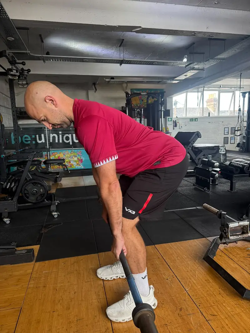 A member partway through a deadlift
